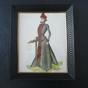 May include: A framed watercolor fashion illustration featuring a woman in a long, gray dress with a red accent. The artwork is in a black, ornate frame. The illustration is signed "Redfern".