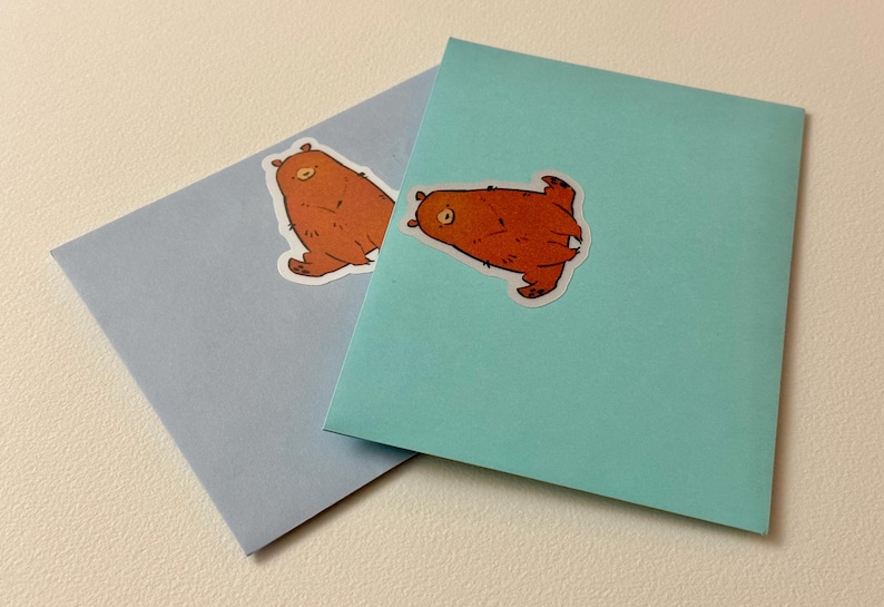 Bear stickers applied to colorful envelopes