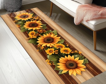 May include: A rectangular runner rug with a wood-grain design and a central floral arrangement. The arrangement features large sunflowers with yellow petals and brown centers, surrounded by green leaves and smaller yellow flowers.