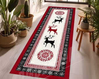 May include: A rectangular runner rug featuring a cream-colored center panel with three reindeer silhouettes in black and red, flanked by two red circular snowflake motifs. The border consists of a black band with white snowflakes and a red edge.