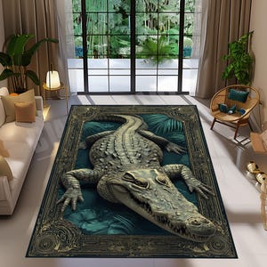 May include: A rectangular area rug featuring a detailed illustration of a crocodile. The rug has a dark teal background with a gold ornate border. The crocodile is depicted in shades of gray and green, with a textured appearance.