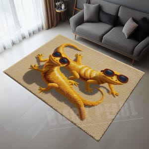 May include: A rectangular beige rug featuring two cartoon lizards wearing sunglasses. The lizards are yellow and orange with black sunglasses. The rug is placed in a living room setting with a gray sofa and curtains.