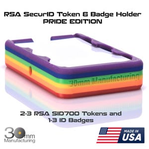 May include: A rainbow-colored RSA SecurID token and badge holder. The Pride Edition holder is designed to hold 2-3 RSA SID700 tokens and 1-3 ID badges. The product is made in the USA and features the text "30mm Manufacturing".