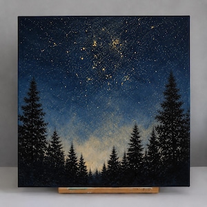 May include: A square canvas painting depicting a dark blue night sky filled with gold-colored star-like speckles above a dense forest of black pine trees. The lower portion of the sky features a soft, glowing light near the tree line.
