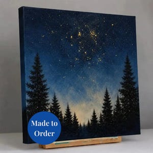 May include: A square canvas painting depicting a dark blue night sky filled with scattered gold-toned stars above a silhouette of dense pine trees. A circular blue badge with the white text Made to Order is overlaid on the bottom left corner.