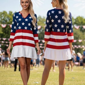 May include: A knee-length dress featuring a patriotic pattern with a blue bodice adorned with white stars, horizontal red and white stripes across the midsection, and a solid white ruffled hem. The dress has three-quarter sleeves and a V-neckline.