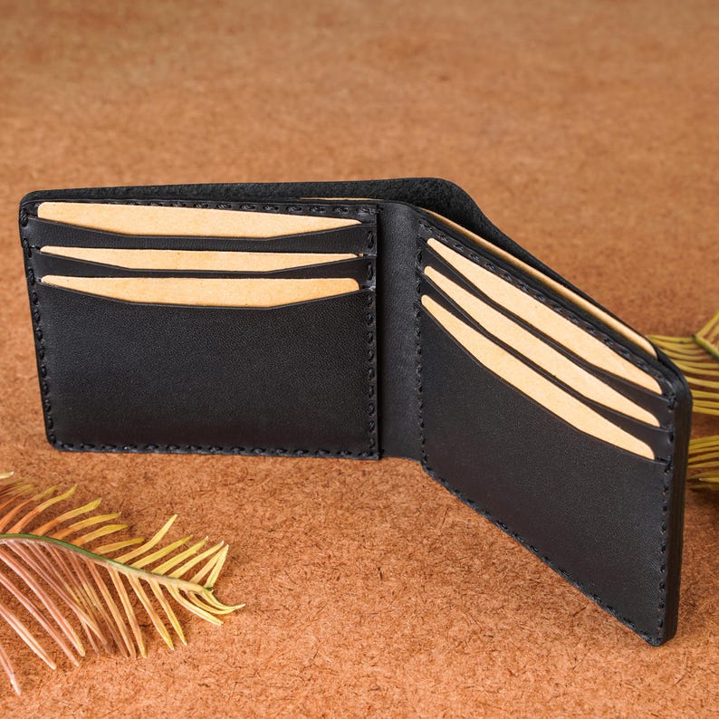 Interior view of handmade python pattern leather wallet in black leather. Slim bifold design with organized card slots and cash compartments. Crafted for durability, style, and practicality, this men’s wallet makes an excellent anniversary gift, birthday present, or groomsmen gift for men who value authentic leather craftsmanship and modern exotic designs.