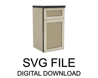 May include: A small, unfinished wooden cabinet with two sections, a top drawer, and a lower door. The cabinet is light brown with a dark top. The text "SVG FILE DIGITAL DOWNLOAD" is displayed below the cabinet.