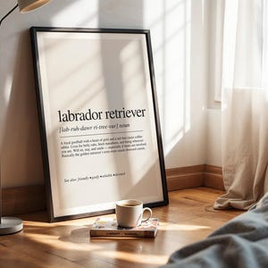 a poster on the floor next to a lamp