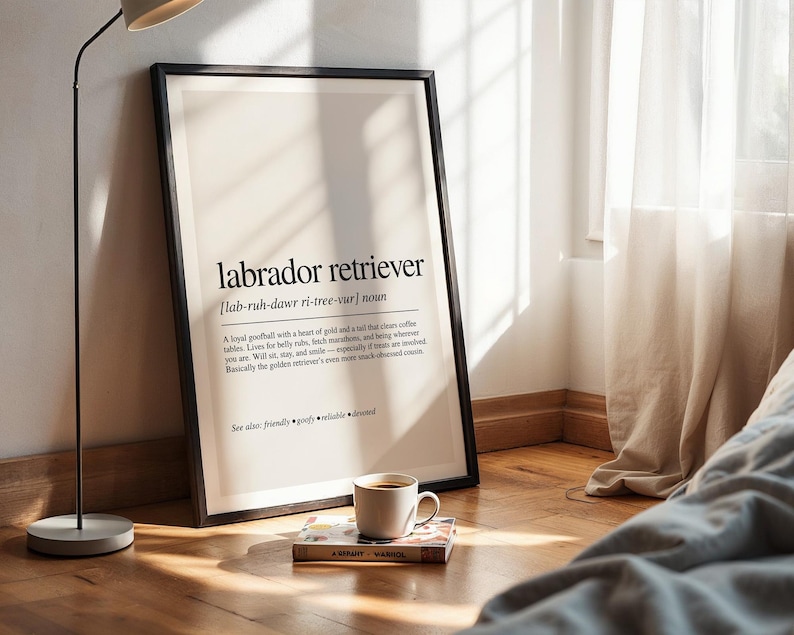 a poster on the floor next to a lamp