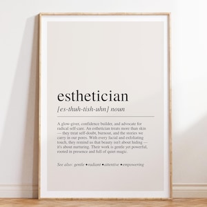 a white framed poster on a wooden floor