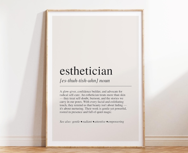 a white framed poster on a wooden floor