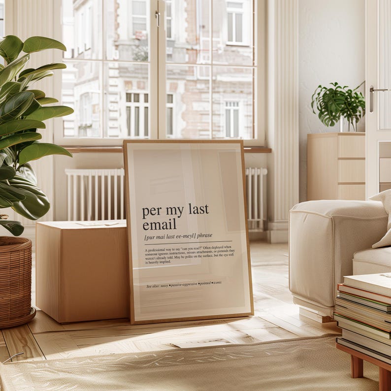 a framed definition of a "last email" in a living room setting.