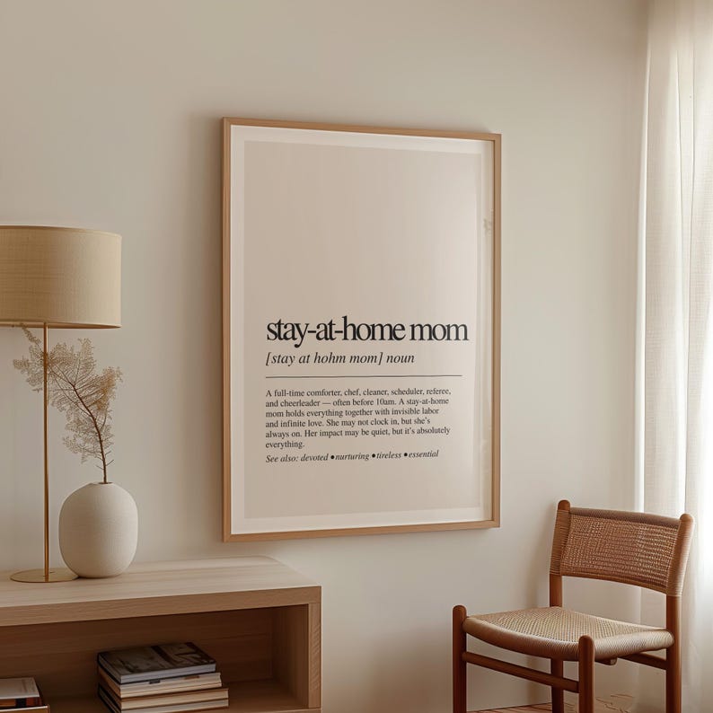 a picture hanging on a wall next to a chair