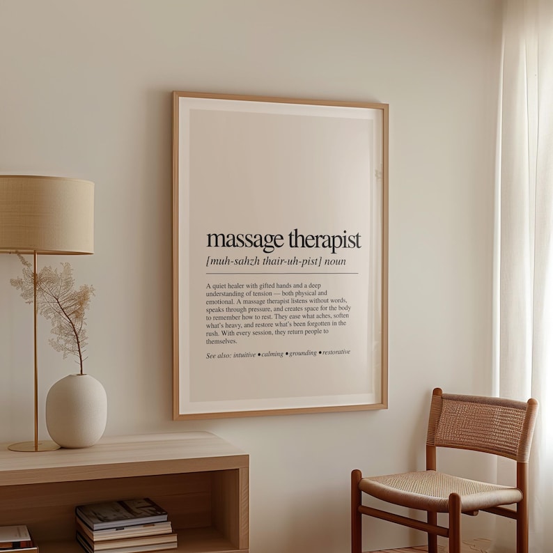 a picture hanging on a wall next to a chair