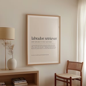 a picture hanging on a wall next to a chair