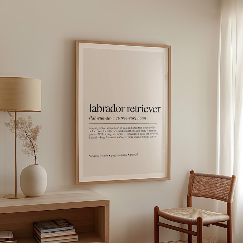 a picture hanging on a wall next to a chair