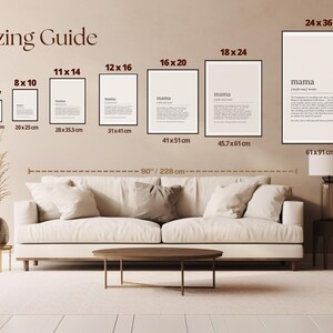 The image displays a living room with a large white sofa, a coffee table, and a lamp. Above the sofa, there is a wall with a guide for choosing and arranging picture frames, providing sizes and dimensions for each frame.