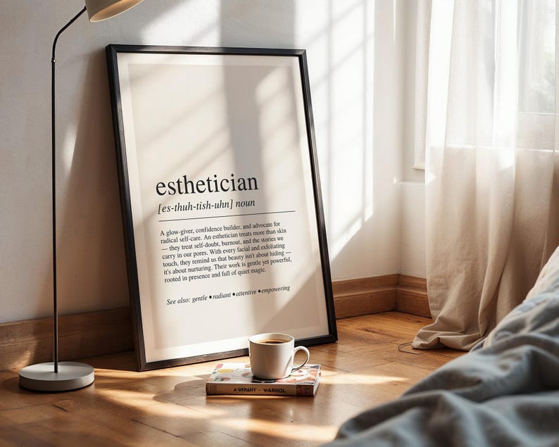 a picture frame sitting on the floor next to a lamp