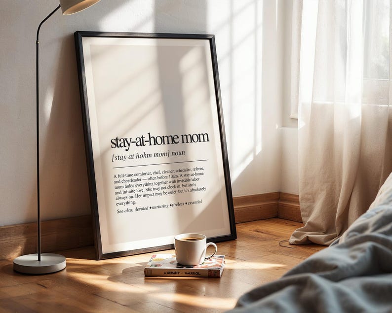 a picture frame sitting on the floor next to a lamp