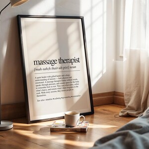 a picture frame sitting on top of a wooden floor next to a lamp