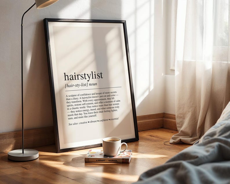 a picture frame sitting on top of a wooden floor next to a lamp