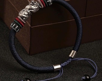 Pulsera de cordón de plata de ley con dragón en espiral hecha a mano