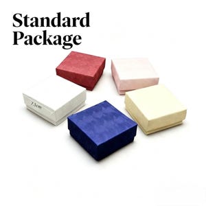 May include: Five square gift boxes labeled Standard Package, featuring a white box with 7.5cm printed on the side, a red box, a light pink box, a cream box, and a blue box. Each box has a textured surface pattern and a removable lid.