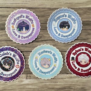 May include: A collection of five round stickers with scalloped edges. Each sticker features a cartoon character illustration within a central circle, surrounded by text. The stickers are in various colors, including purple, blue, and red, with the text "Waifu" and "Love & Deepspace".