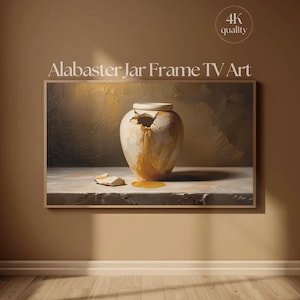 Op de afbeelding: Een ingelijst digitaal kunstwerk getiteld "Alabaster Jar Frame TV Art". De afbeelding toont een gebarsten, gebroken witte vaas met een gouden vloeistof die eruit stroomt. Het kunstwerk staat tegen een neutrale achtergrond, met een 4K-kwaliteitslabel.