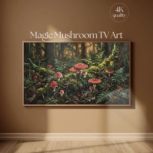 May include: A rectangular wall art print titled Magic Mushroom TV Art featuring a forest floor scene with multiple red-capped mushrooms with white spots, green ferns, and dark mossy ground textures, displayed in a thin wooden frame.