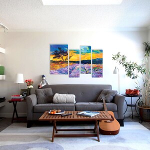 May include: A living room with a gray couch, a wooden coffee table, and a multi-panel painting of a lavender field with a tree and a sunset.