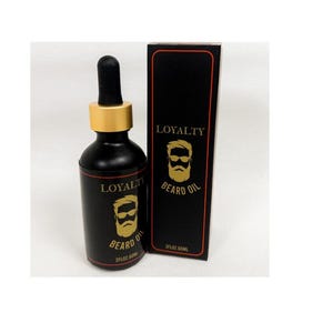 May include: A black bottle with a gold label and a gold dropper top. The label says "Loyalty Beard Oil" and features a cartoon image of a bearded man wearing sunglasses. The bottle is next to a black box with a gold label that says "Loyalty Beard Oil".