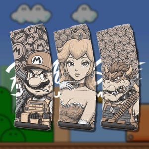 May include: Three rectangular firearm magazines featuring detailed illustrations of video game characters. The left magazine shows a character in a tactical vest, the center shows a crowned character, and the right shows a horned character with a cigar.