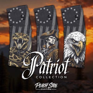 May include: Three black firearm magazines featuring American-themed graphics: a coiled rattlesnake, a colonial soldier, and a bald eagle. Each magazine displays a circle of thirteen stars and vertical stripes. Text reads Patriot COLLECTION and PEACH STATE CUSTOM.
