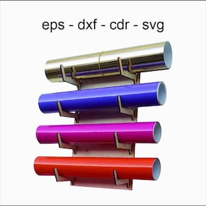 May include: A wooden wall-mounted vinyl roll holder with four rolls of vinyl in gold, blue, magenta, and red. The text "eps - dxf - cdr - svg" is at the top. The holder is made of light brown wood.