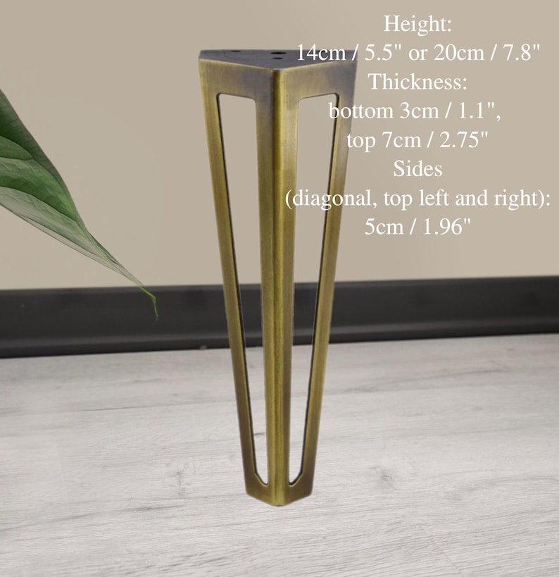 May include: A single, bronze-colored metal furniture leg. The leg is triangular with a flat top and tapers to a point. The height is 14cm/5.5" or 20cm/7.8". The thickness is 3cm/1.1" at the bottom and 7cm/2.75" at the top. The sides are 5cm/1.96".