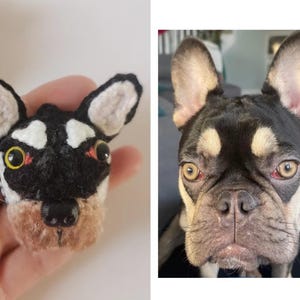 May include: Crocheted black and white dog toy with red and yellow eyes. The toy is a close-up of a French Bulldog.