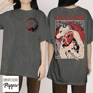 May include: Dark grey t-shirt with a graphic design on the front and back. The front features a red and black illustration within a circle. The back displays a detailed anime-style illustration with a wolf, a masked figure, and Japanese text.