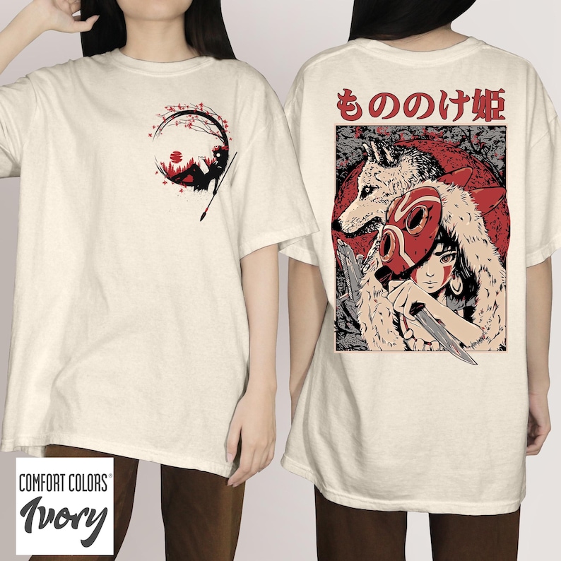 May include: Ivory-colored t-shirts with graphic designs. One shirt features a black and red illustration within a circle. The other shirt displays a red mask, wolf, and Japanese text. The shirts are from Comfort Colors.