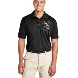 May include: Black polo shirt with a collar and short sleeves. The shirt features a graphic on the left chest with the text "Chief Master Sergeant Retired" and a Native American chief illustration. The shirt is paired with khaki pants.