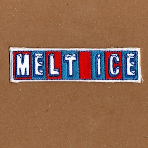 May include: Embroidered patch with the words "MELT ICE" in white capital letters. The patch has a rectangular shape with a blue border and a red vertical stripe in the middle. The background is a solid brown colour.
