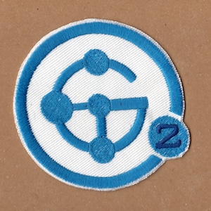 May include: Blue and white embroidered patch with a stylized network design and the number "2" in a circle.