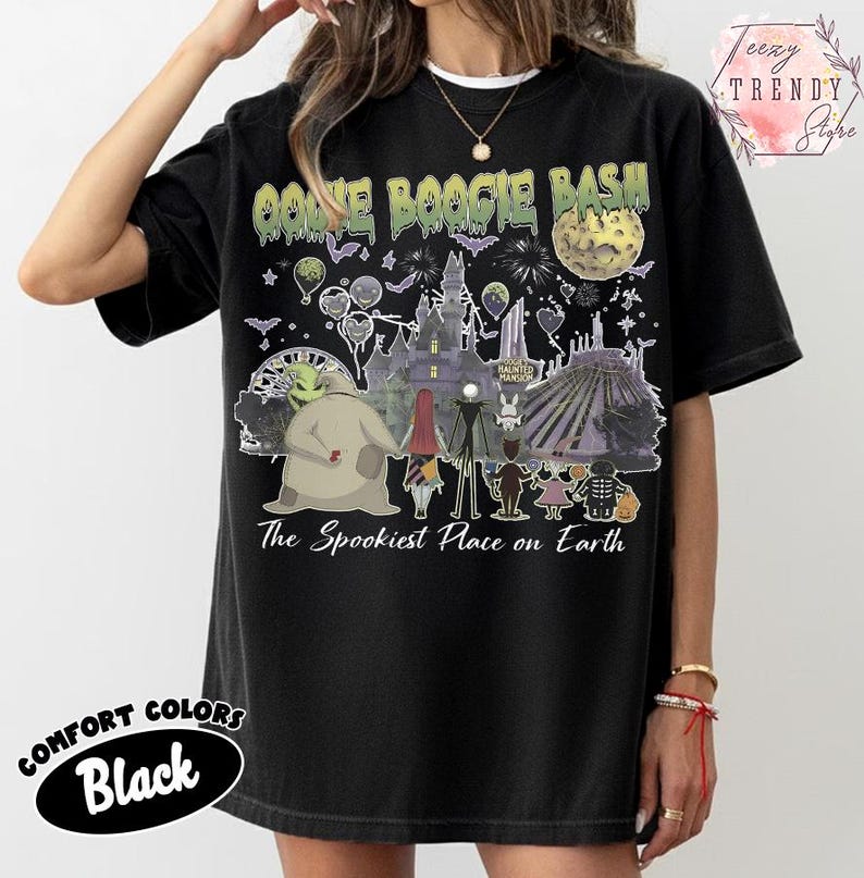 May include: A black t-shirt featuring a graphic print with the text OOGIE BOOGIE BASH and The Spookiest Place on Earth. The design includes illustrations of characters, a castle, a ferris wheel, a moon, and fireworks in various colors.