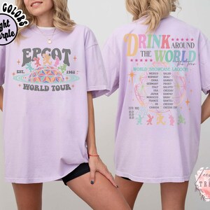 May include: Light purple t-shirt with "EPCOT World Tour" graphic on the front and "Drink Around the World" design on the back. The front graphic features the EPCOT logo and the year 1982. The back design lists countries and phrases.