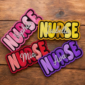 May include: Embroidered patches in various colors spelling "NURSE" with different names: Sophia, Isabella, Mia, and Ava. Each patch has a black border and is set against a wooden background.