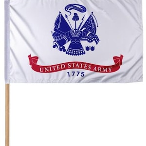 May include: A white flag with the United States Army emblem in blue and a red banner that reads "UNITED STATES ARMY 1775." The flag is mounted on a wooden pole with a gold-colored tip.