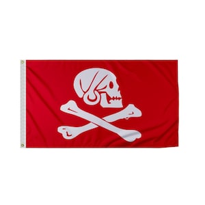 May include: A red pirate flag with a white skull and crossbones. The skull is wearing a white bandana.