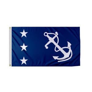 May include: A blue flag with three white stars and a white anchor in the center.