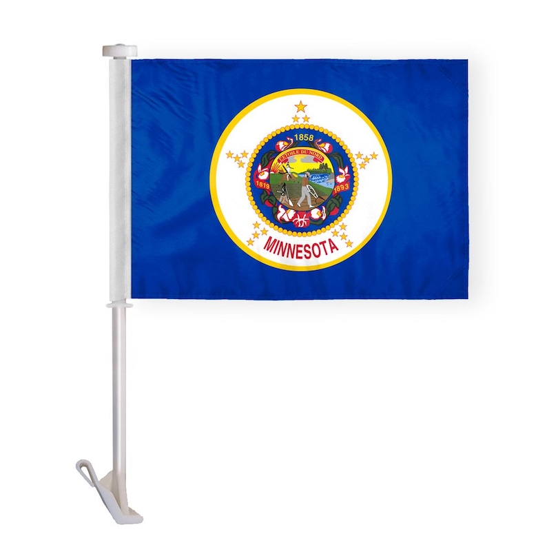 May include: A white car flagpole with a blue Minnesota state flag. The flag features a gold seal with a white star and the words "L'ETOILE DU NORD" and "MINNESOTA".